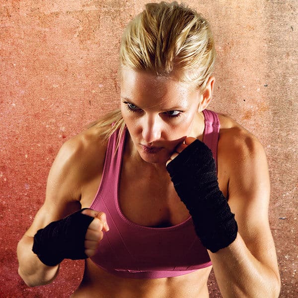 Mixed Martial Arts Lessons for Adults in Union NJ - Lady Kickboxing Focused Background