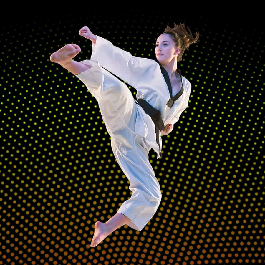 Martial Arts Lessons for Adults in Union NJ - Girl Black Belt Jumping High Kick
