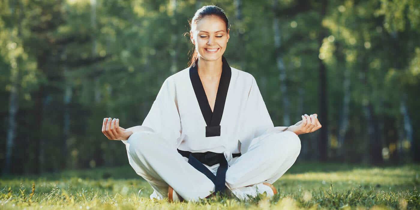 Martial Arts Lessons for Adults in Union NJ - Happy Woman Meditated Sitting Background